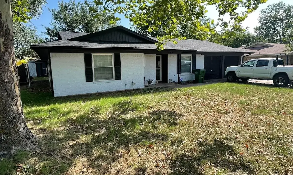 Professional roofing crew working on a residential roof in Winder